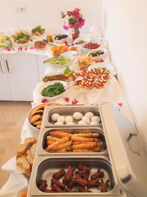 a table with many plates of food on it at Medimar Hotel in Kaş
