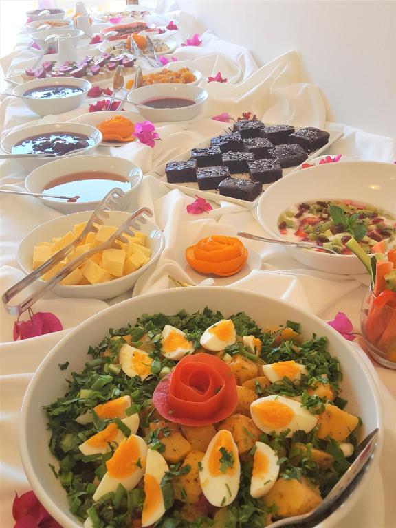 a table with many plates of food on it at Medimar Hotel in Kaş
