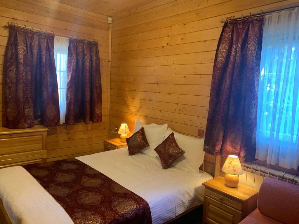Postel nebo postele na pokoji v ubytování Alpin Borovets, Алпин Боровец