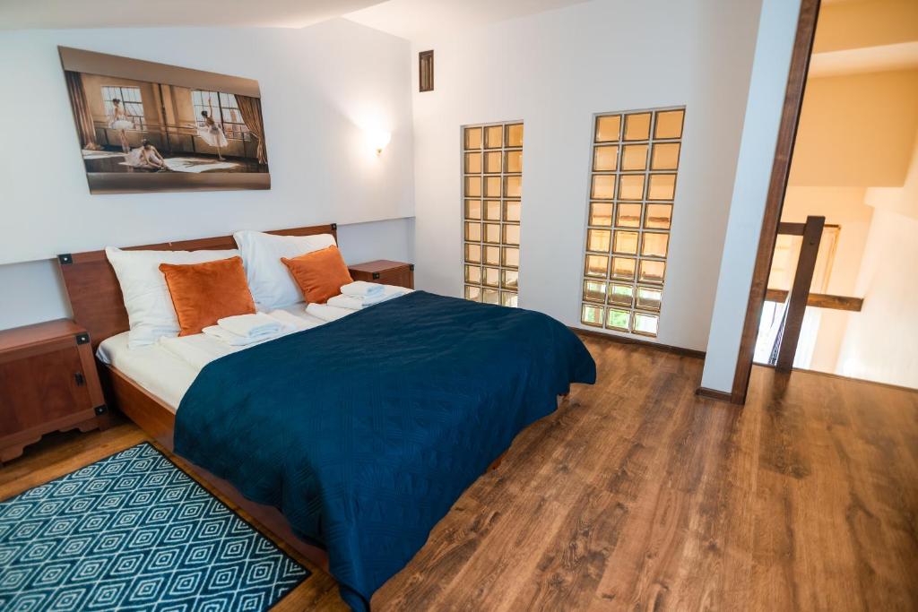 Posteľ alebo postele v izbe v ubytovaní Karkonosky Apartamenty - Huta Szkła