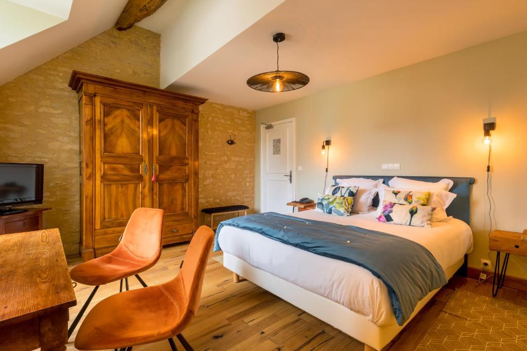 Postel nebo postele na pokoji v ubytování Hôtel Le Clos