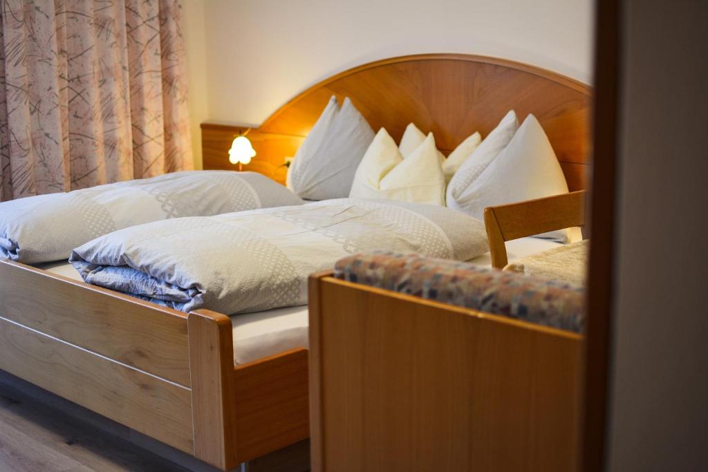 Postel nebo postele na pokoji v ubytování Appartements Residence Ganthaler