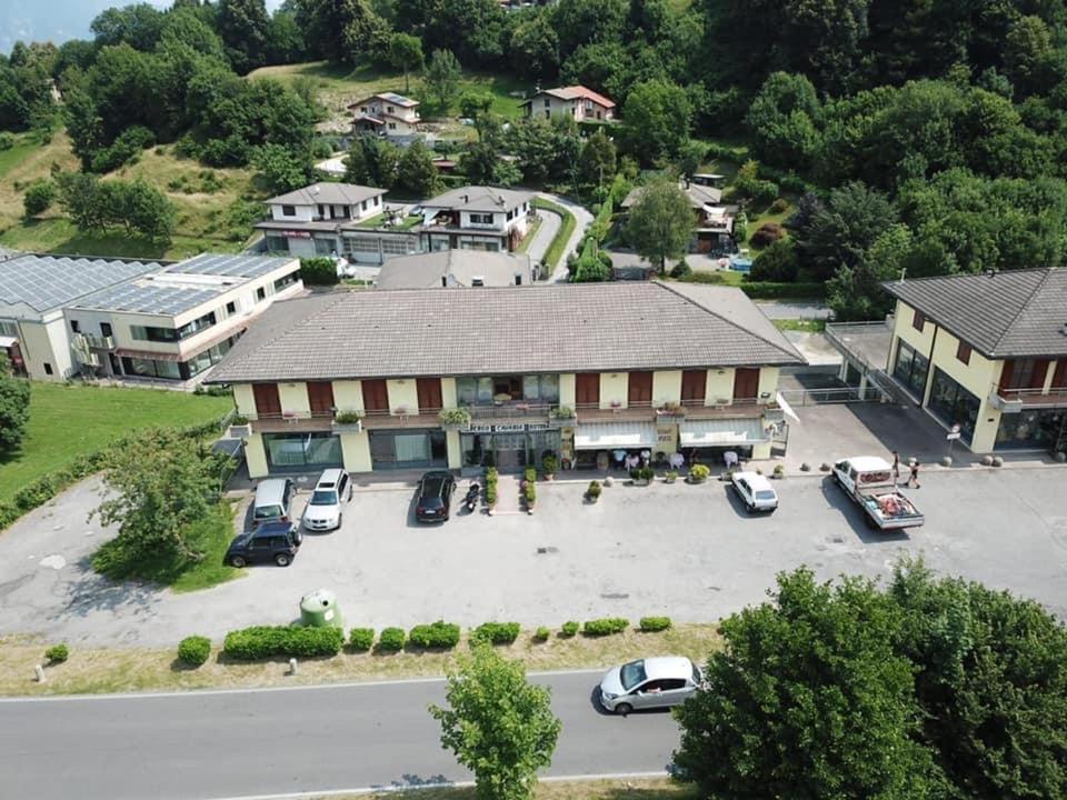 an aerial view of a building with a parking lot at Hotel Cavaria in San Fedele Intelvi