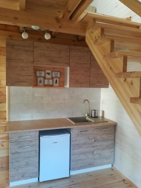 Kuchyň nebo kuchyňský kout v ubytování Domek pod jabłonią Mikoszewo