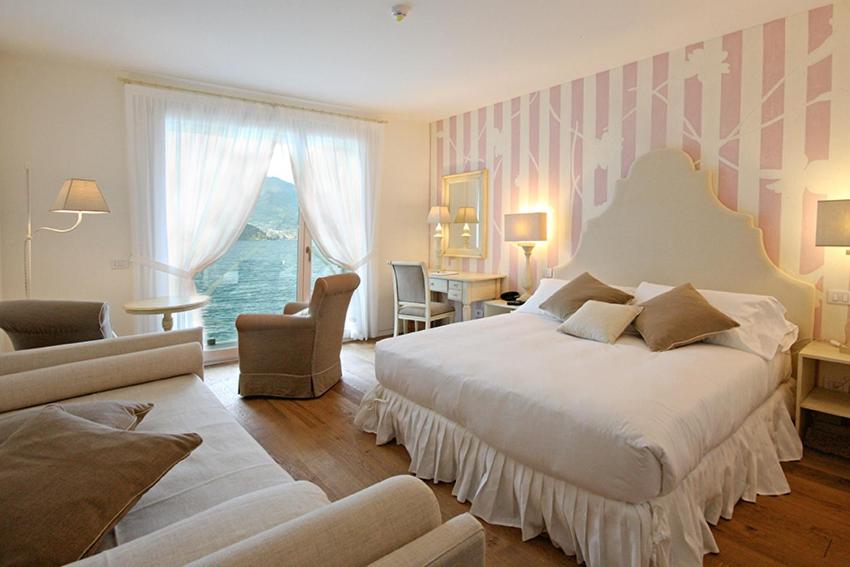 Łóżko lub łóżka w pokoju w obiekcie Hotel Villa Aurora