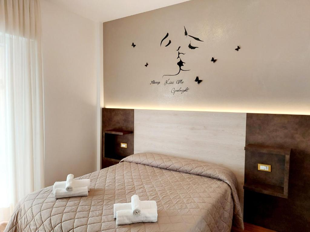 Postel nebo postele na pokoji v ubytování Hotel Monica