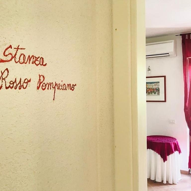 Postel nebo postele na pokoji v ubytování Il carrubo B&b