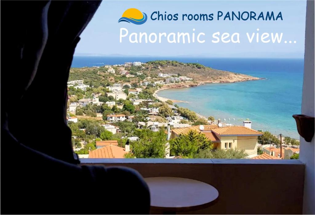 a view of a beach from a room with a window at Chios Panorama in Karfas