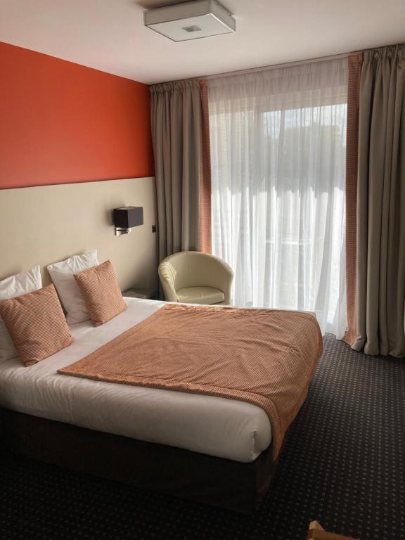 Postel nebo postele na pokoji v ubytování Hotel Georges