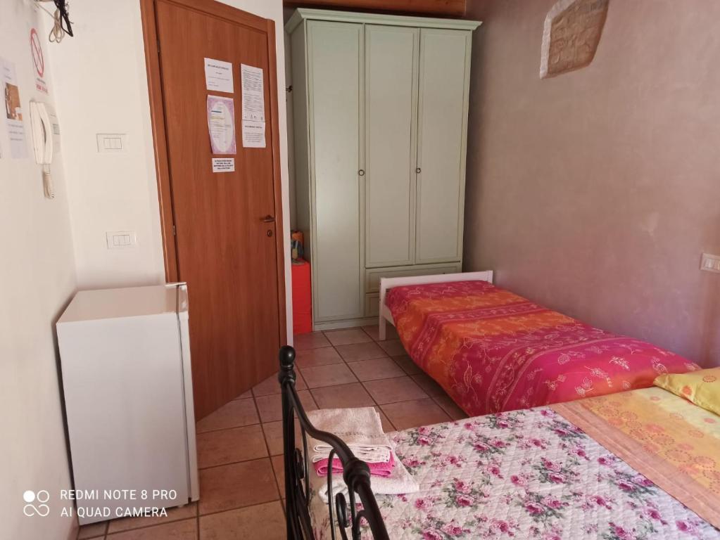 Posteľ alebo postele v izbe v ubytovaní Bed & Breakfast Onda Blu