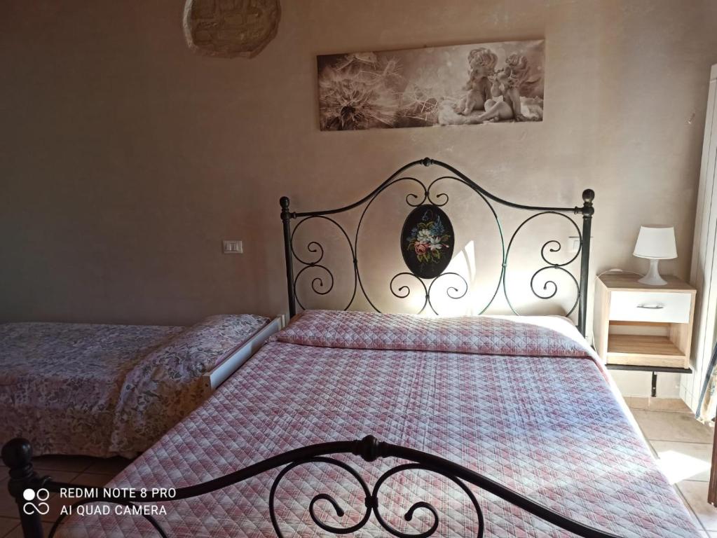 Posteľ alebo postele v izbe v ubytovaní Bed & Breakfast Onda Blu