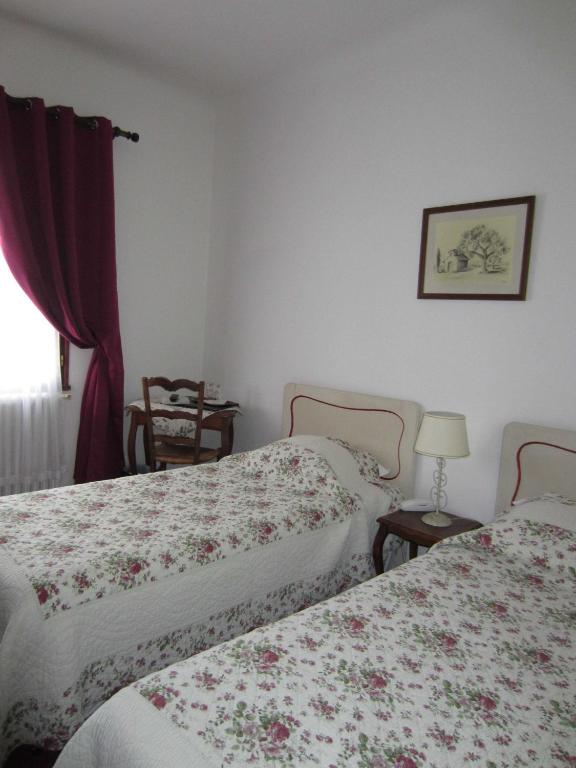 Letto o letti in una camera di Hotel Belle Vue