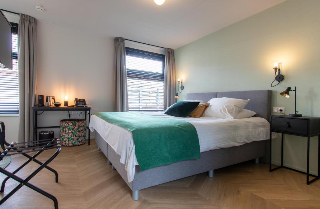 Postel nebo postele na pokoji v ubytování Hotel van der Meer