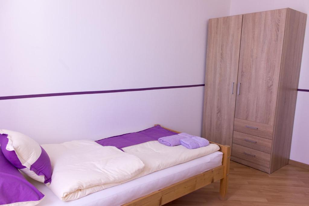 Posteľ alebo postele v izbe v ubytovaní Apartman "A"