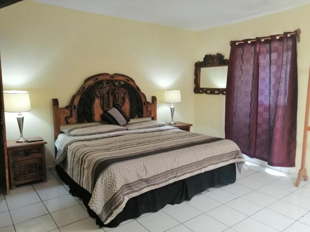 Postel nebo postele na pokoji v ubytování Hotel Chely
