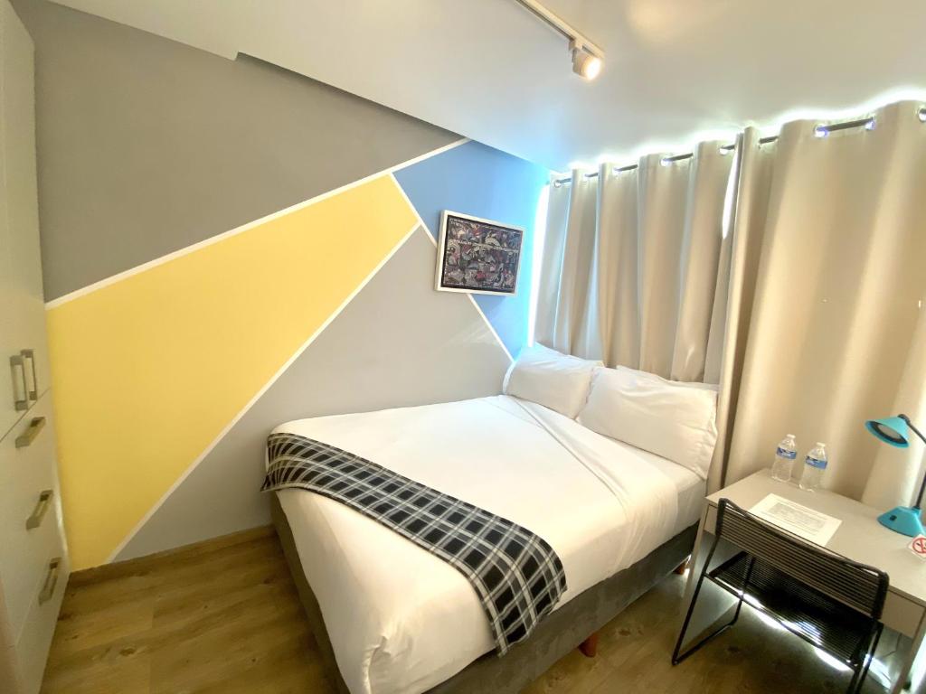 Postel nebo postele na pokoji v ubytování Kubo Hotel