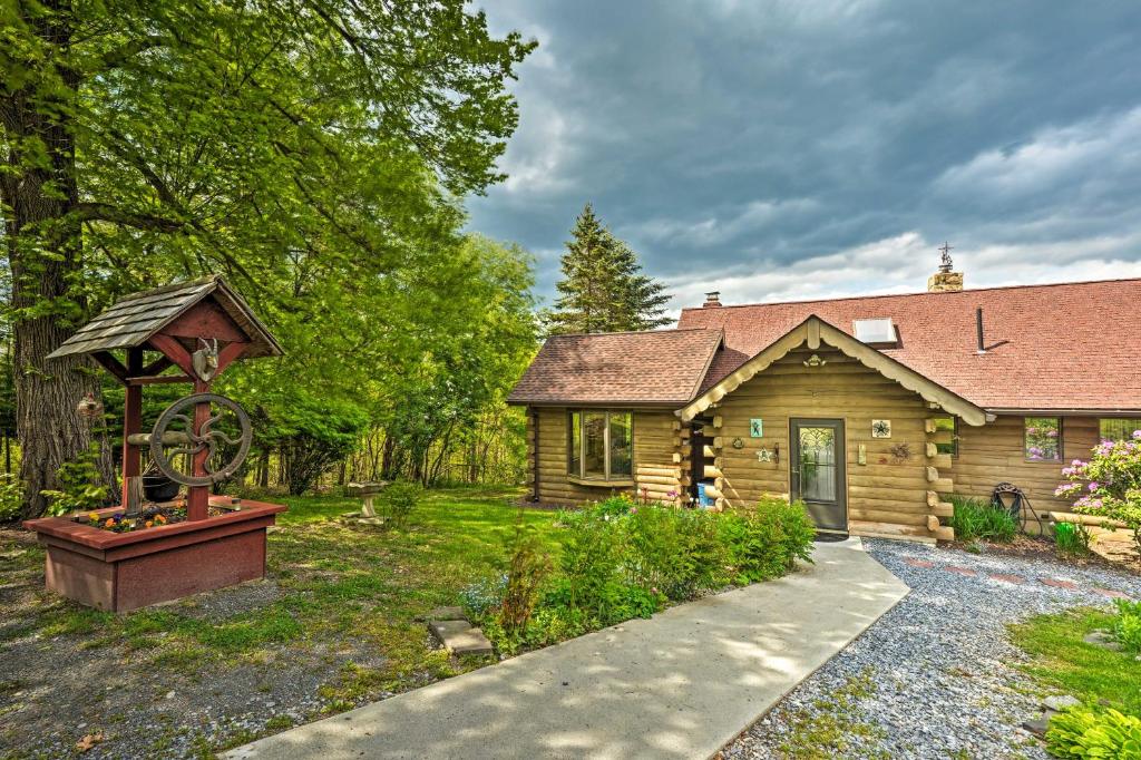 a log cabin with a gazebo in the yard at Bedford House on 1 Acre with Deck, Views! in Bedford