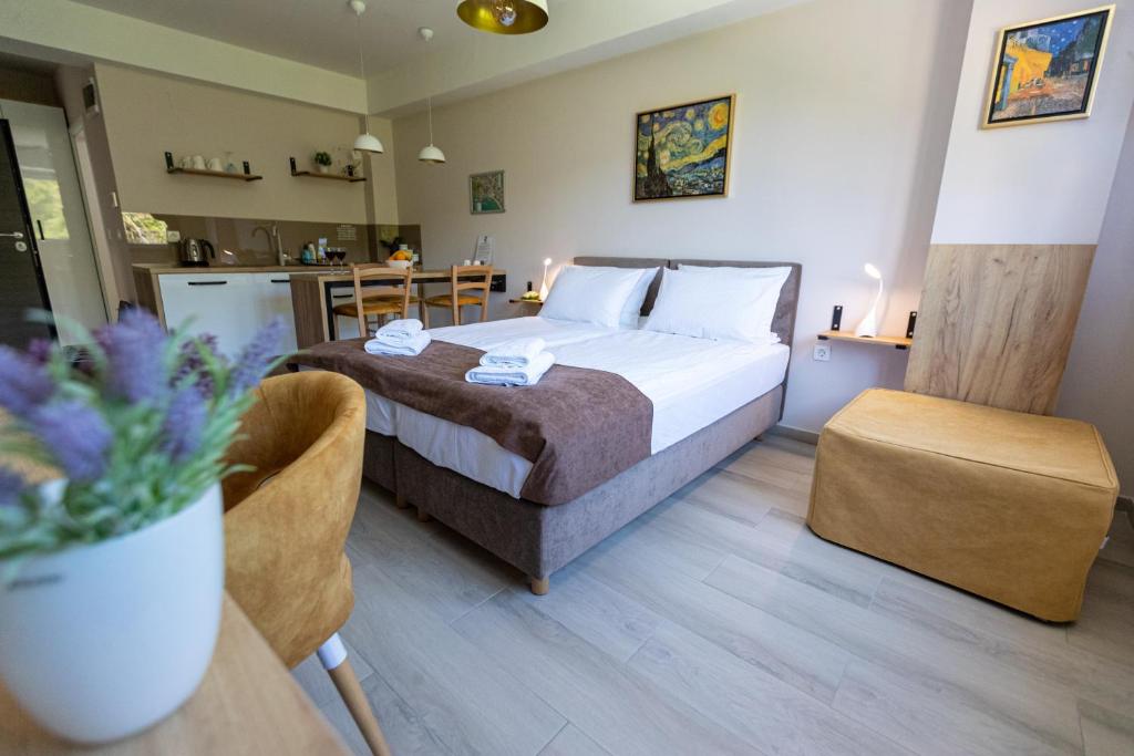 a hotel room with a bed and a kitchen at Kate Central Apartments in Ohrid