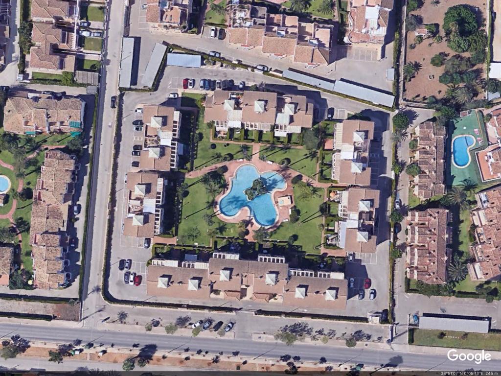 an overhead view of a city with a park at La Rosaleda 82 in Denia