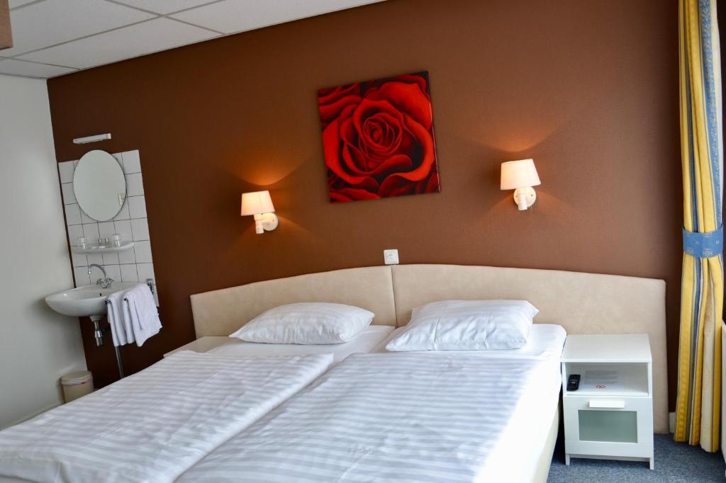 Postel nebo postele na pokoji v ubytování Hotel De Stern