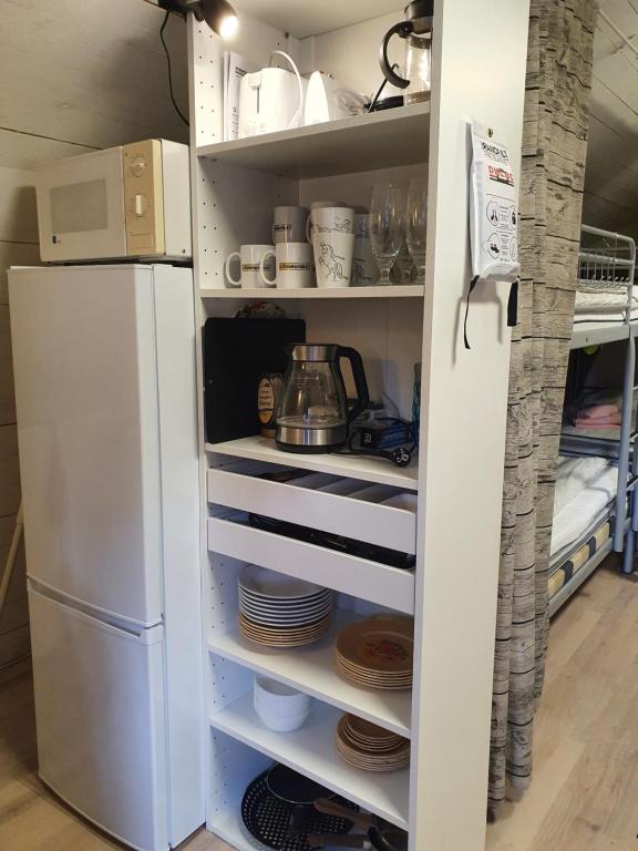 Kuchyň nebo kuchyňský kout v ubytování Rialahästgård