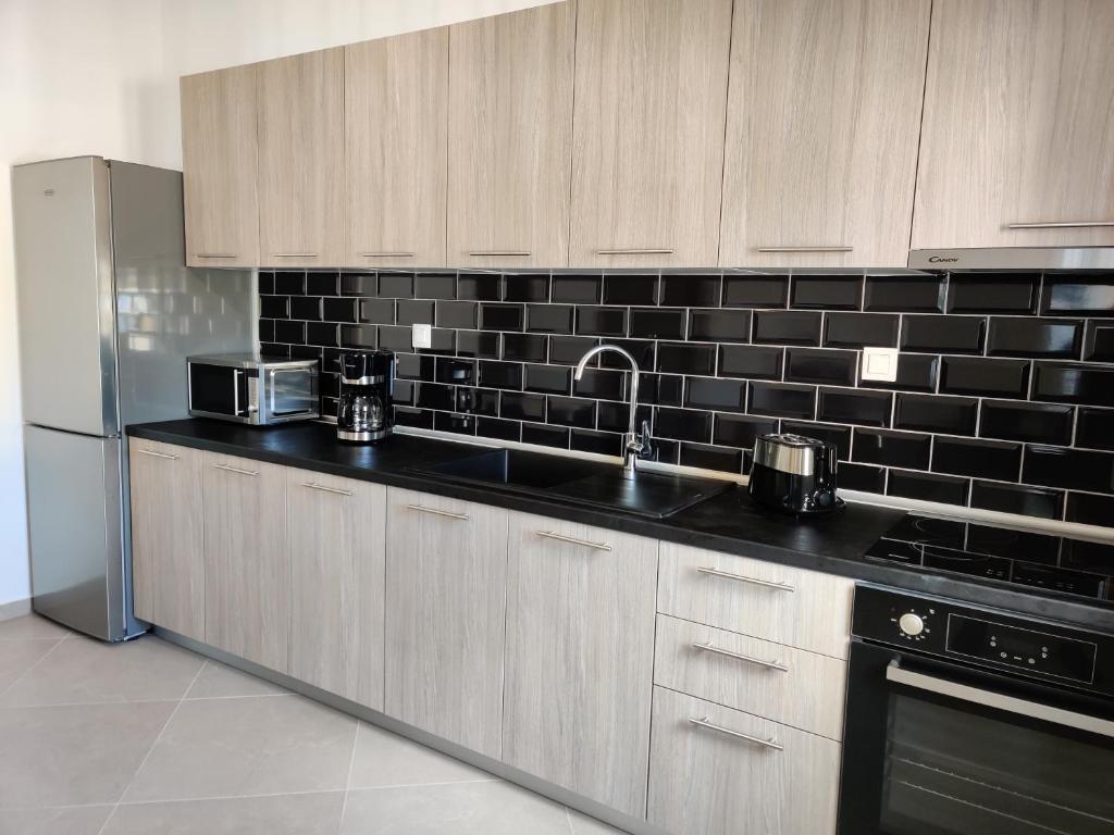 Kuchyň nebo kuchyňský kout v ubytování Mare Monte Luxury Apartments 3
