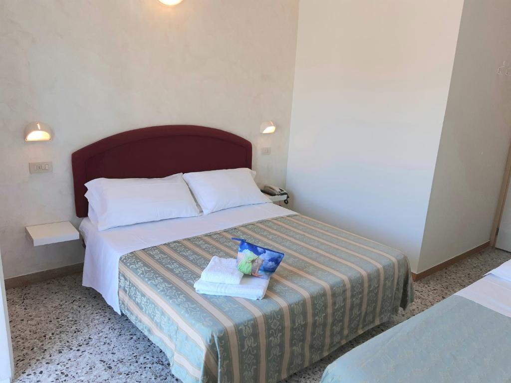 Postel nebo postele na pokoji v ubytování Hotel Raul