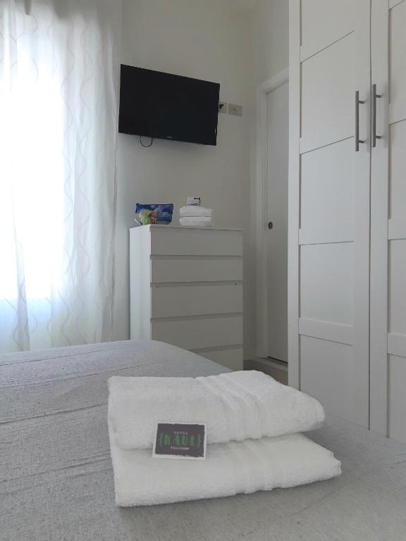 Postel nebo postele na pokoji v ubytování Hotel Raul