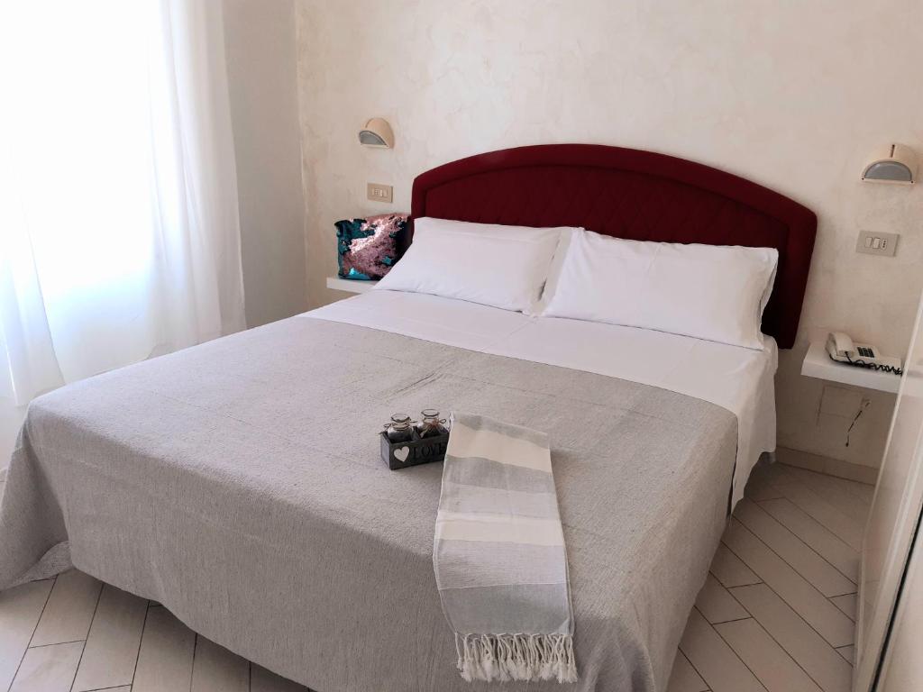 Postel nebo postele na pokoji v ubytování Hotel Raul
