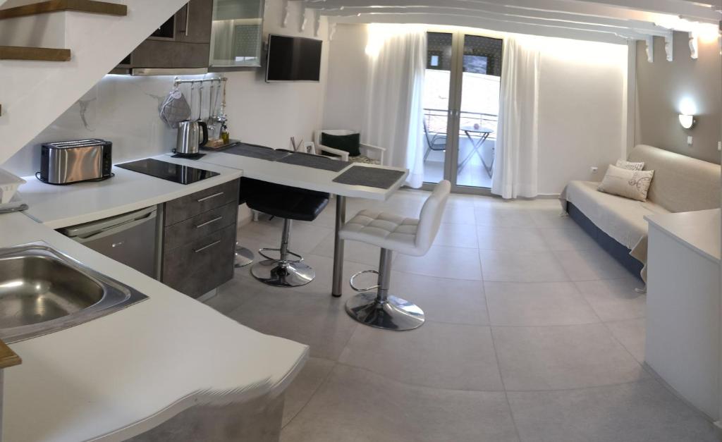 A kitchen or kitchenette at Irida Holiday Apartments