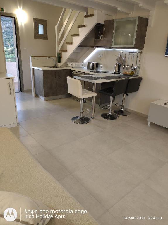 A kitchen or kitchenette at Irida Holiday Apartments