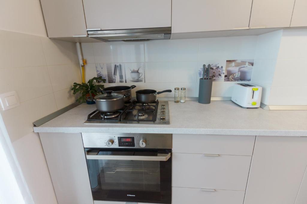 Kuchyň nebo kuchyňský kout v ubytování Gold Class Apartments AMS