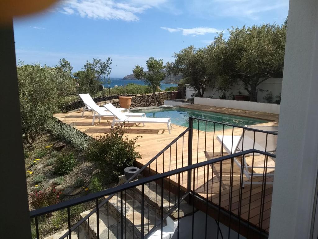 a view from the balcony of a villa with a swimming pool at Casa Margot2 in Cadaqués