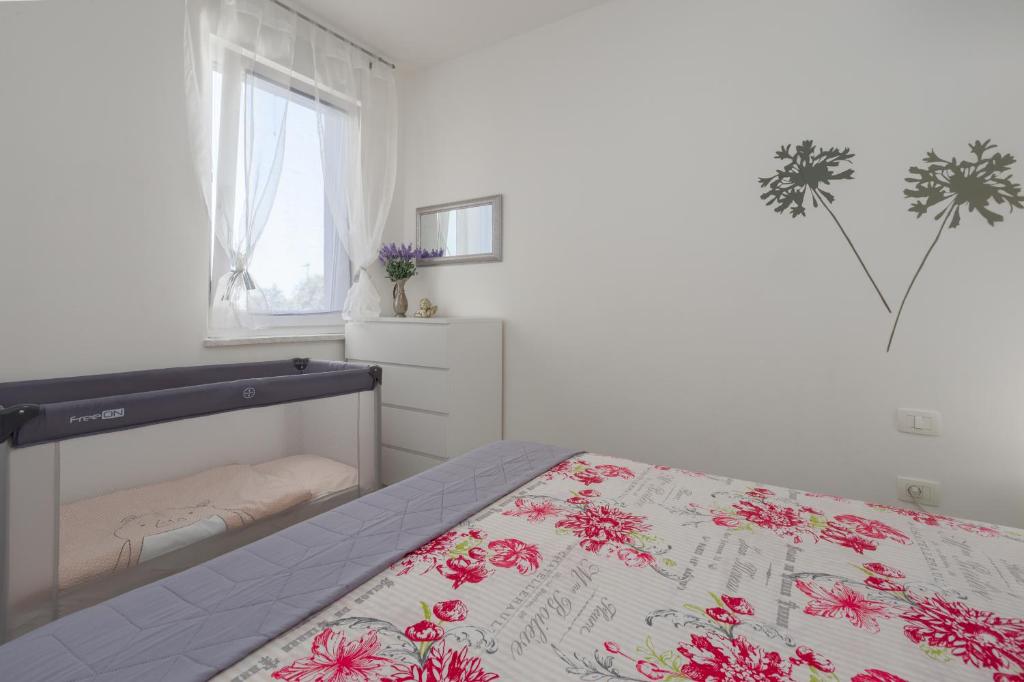 Postel nebo postele na pokoji v ubytování Villa Ivan Umag