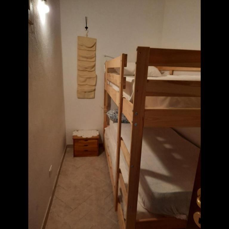 A bed or beds in a room at Casetta alla Caduta