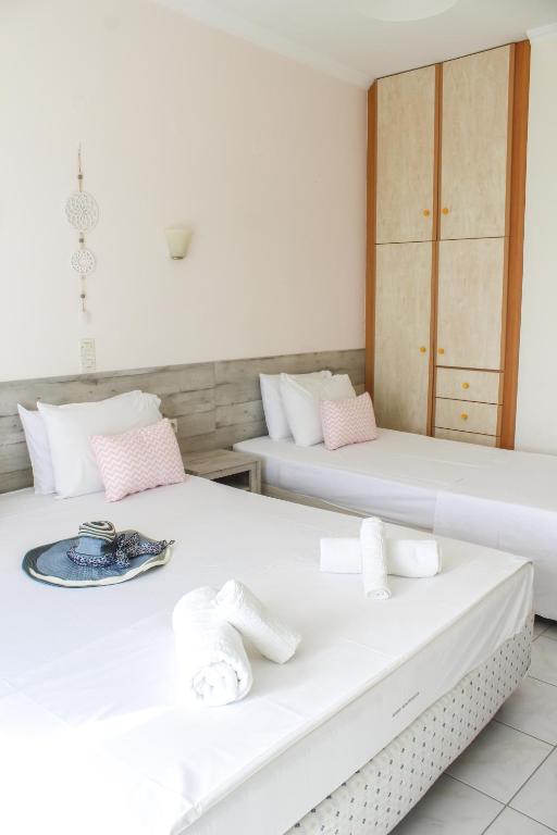 Postel nebo postele na pokoji v ubytování Iason Apartments