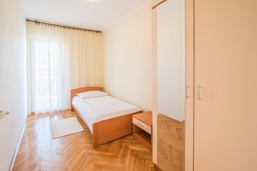 Posteľ alebo postele v izbe v ubytovaní Apartments Ana S