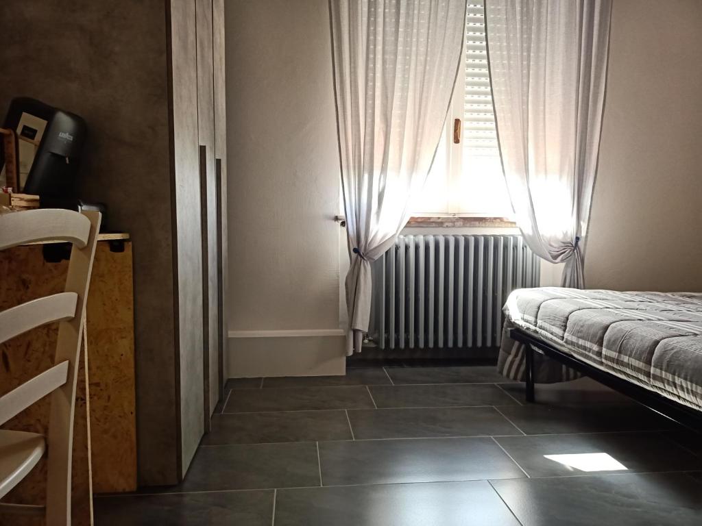 Postel nebo postele na pokoji v ubytování LE MURA Foresteria