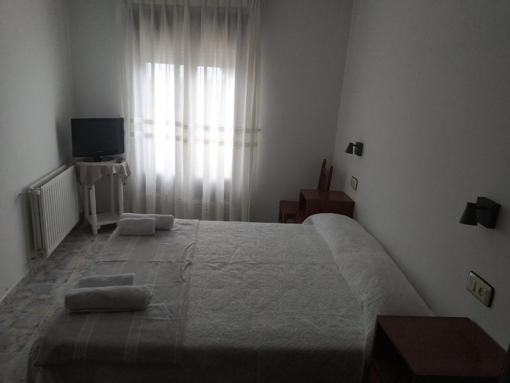 Cama o camas de una habitación en Hostal Arribes del Duero