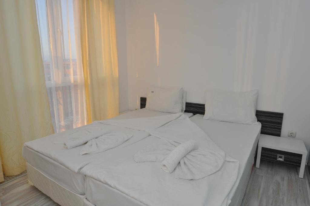 Postel nebo postele na pokoji v ubytování Boutique Suites Rainbow 4