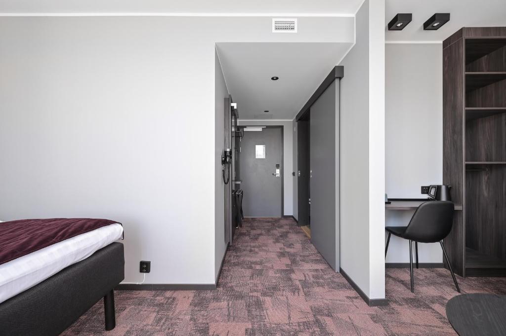 Postel nebo postele na pokoji v ubytování Hotel Fridhem