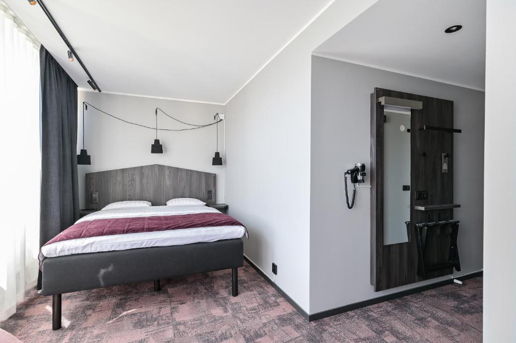 Postel nebo postele na pokoji v ubytování Hotel Fridhem