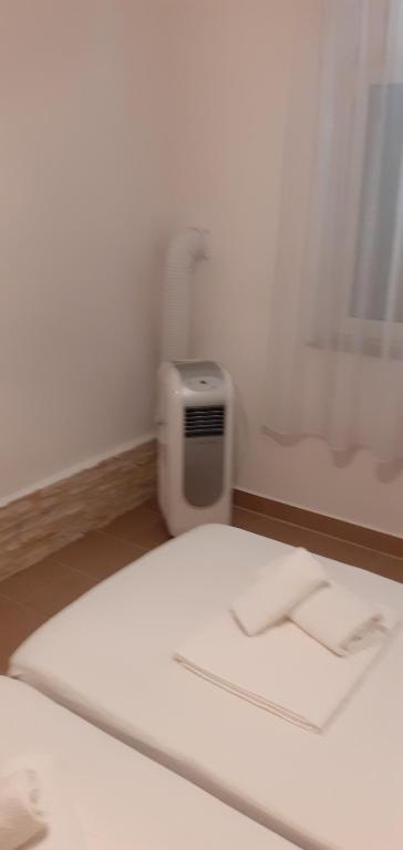 Postel nebo postele na pokoji v ubytování Apartman LETI