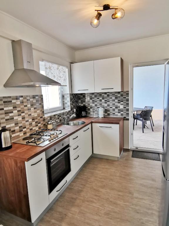 Kuchyňa alebo kuchynka v ubytovaní Apartment Roman