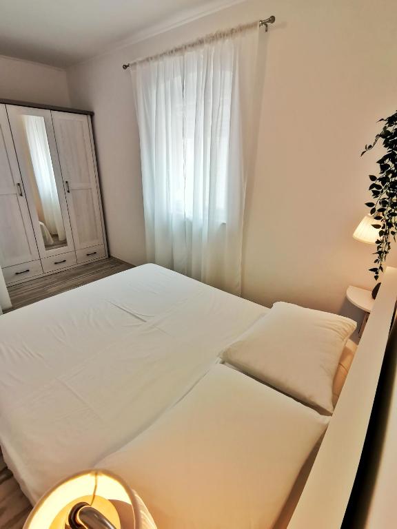 Posteľ alebo postele v izbe v ubytovaní Apartment Roman