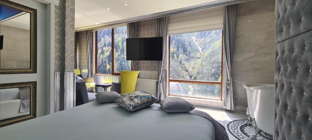 Postel nebo postele na pokoji v ubytování Ayder Doga Resort