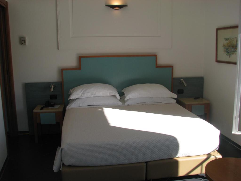 Postel nebo postele na pokoji v ubytování Hotel Belvedere