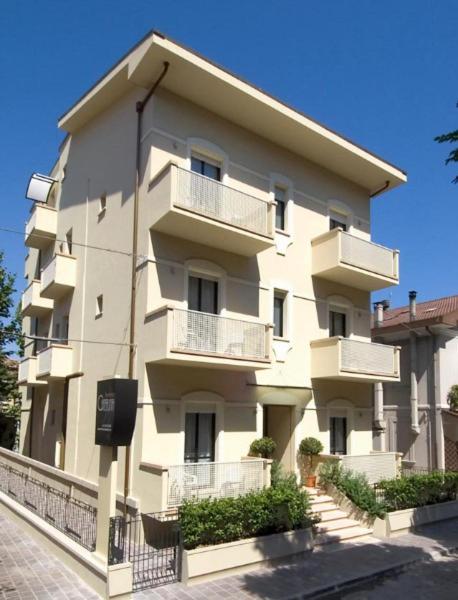 a large building with balconies on the side of it at Residence Caterina in Cattolica