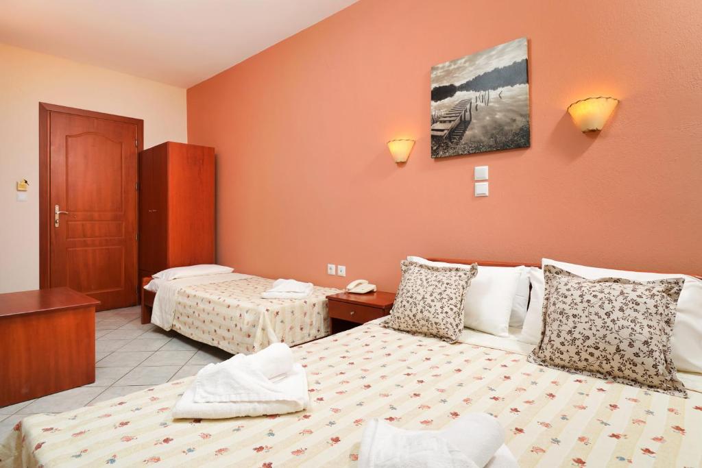 Postel nebo postele na pokoji v ubytování Hotel Makrina