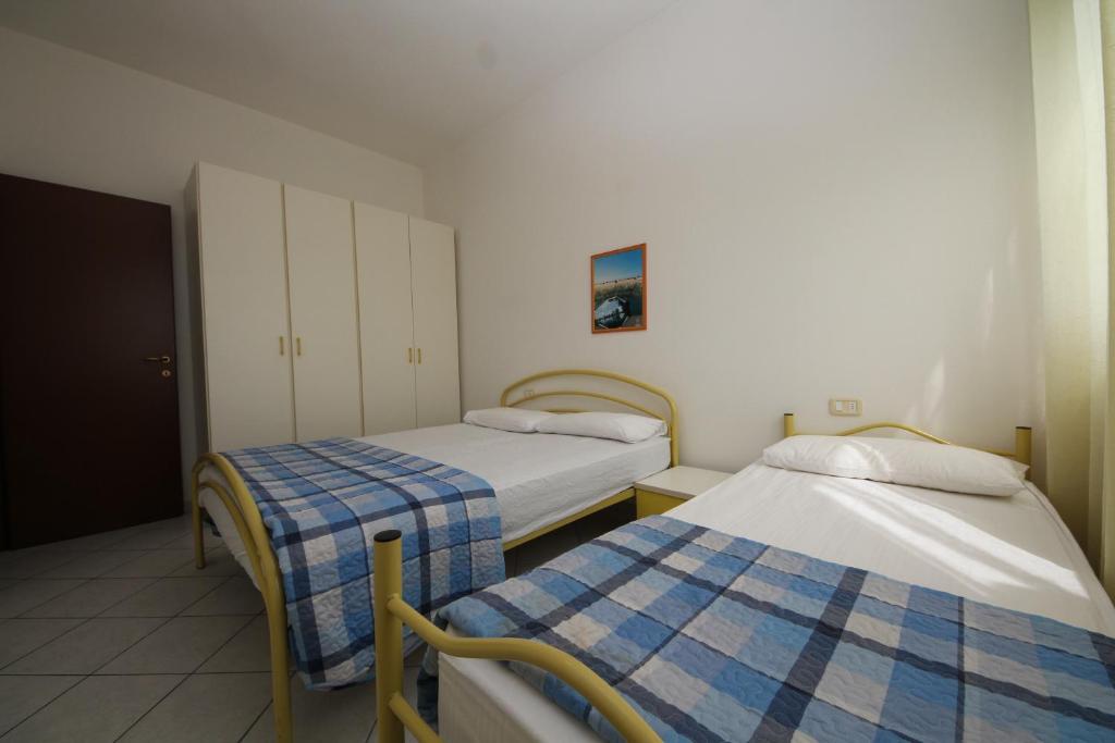 Postel nebo postele na pokoji v ubytování Acquasmeralda appartamento 03